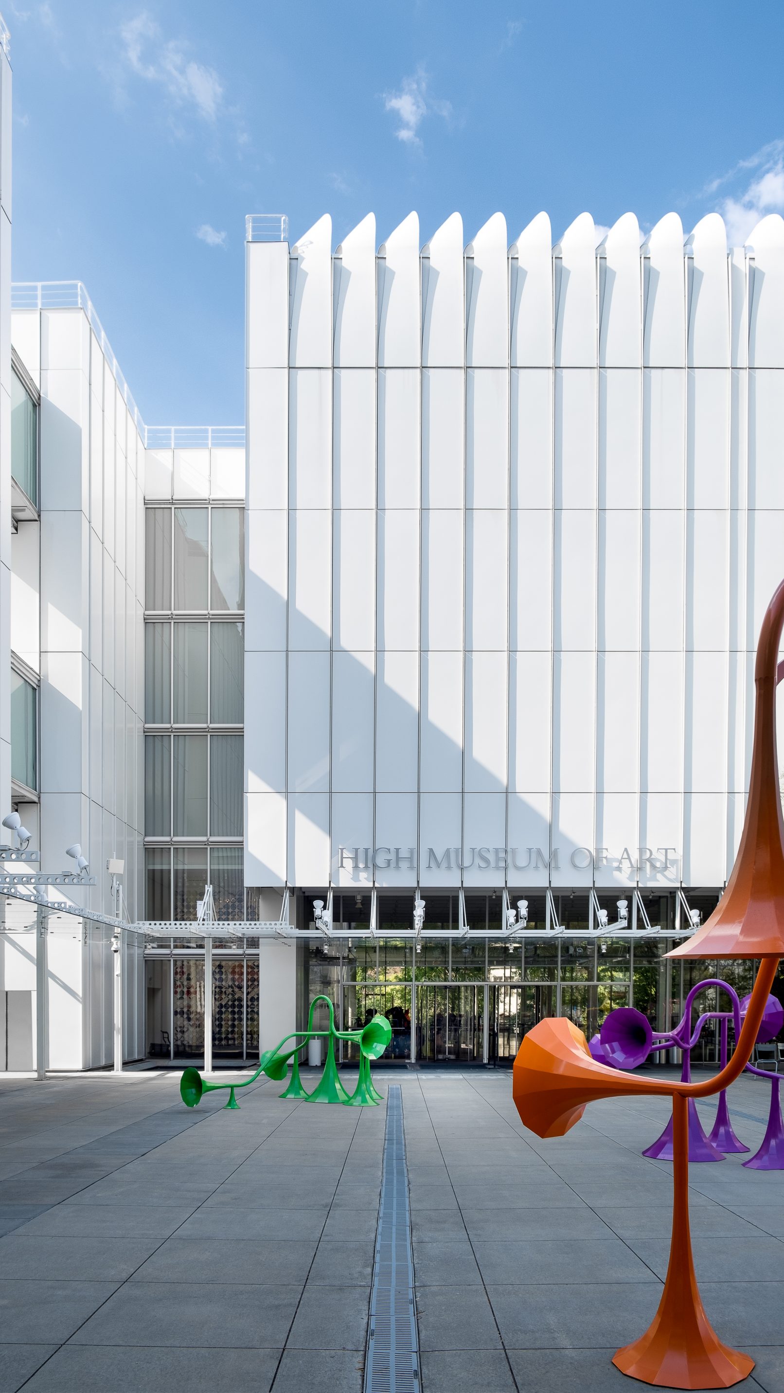Architectural Photography of the High Museum of Art in Atlanta Georgia in a one point perspective from the main quad of the museum center with some horn-like sculptures placed throughout