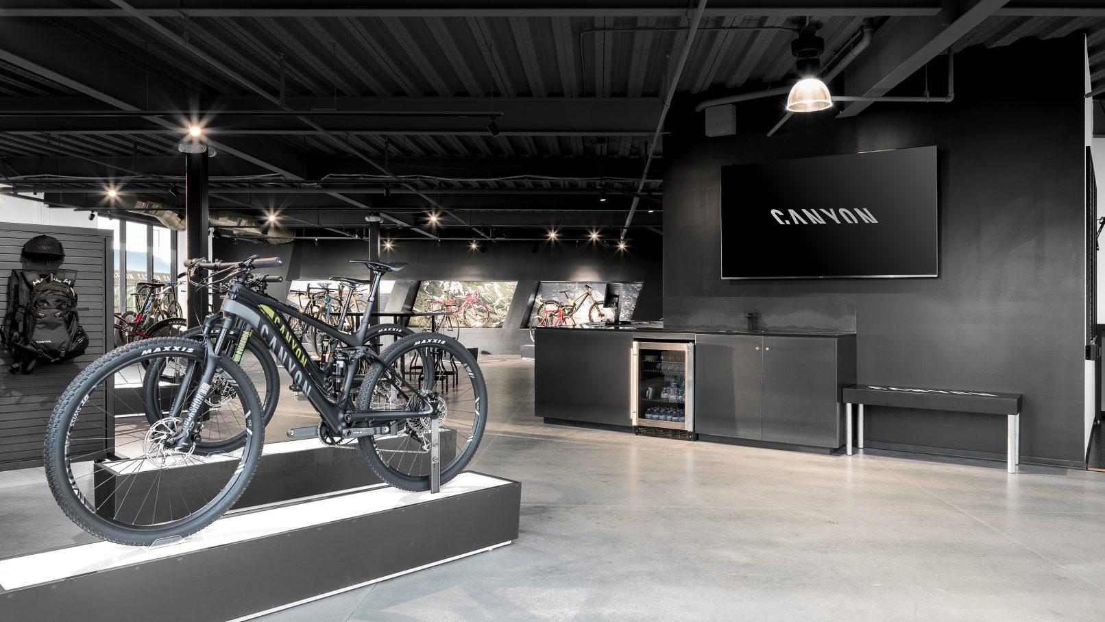 Commercial Building Photography of a Canyon Bicycle Shop in San Diego County California featuring two mountain bikes in the foreground and the checkout counter in the rear of the scene
